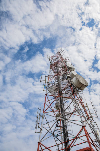 istock Telecommunication transmission tower, clear sky background 1298514448