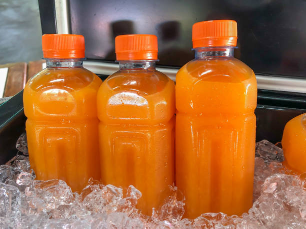 istock Orange juice in plastic bottle 1298515289