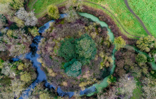 Looking down at an 11th century motte-and-bailey earth fortification in Suffolk, UK Looking down at an 11th century motte-and-bailey earth fortification in Suffolk, UK bailey castle photos stock pictures, royalty-free photos & images