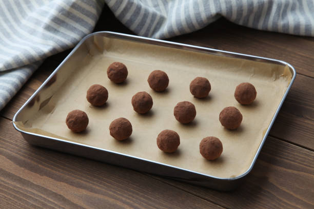 istock chocolate truffles on silver plate on wooden table 1298524438