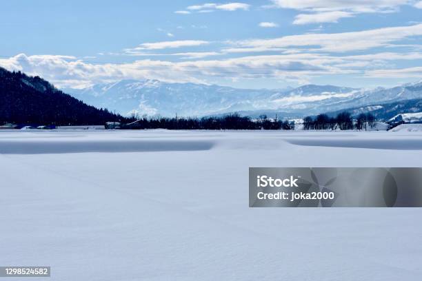 Winter Mountains And Paddy Fields Covered With Snow Stock Photo - Download Image Now