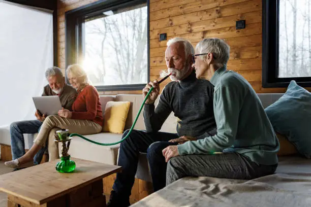 Photo of Senior couples spending their time in the living room.