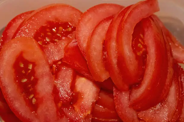 cut fresh red tomatoes in selective focus