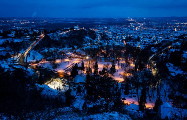 istock Pecs city at night from above in blue hour 1298525913