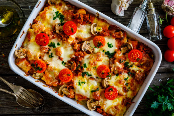 Pasta casserole with barbecue chicken breast, cheese and vegetables Pasta casserole with barbecue chicken breast, cheese and vegetables pasta casserole stock pictures, royalty-free photos & images