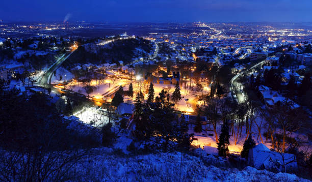 istock Pecs city at night from above in blue hour 1298526463