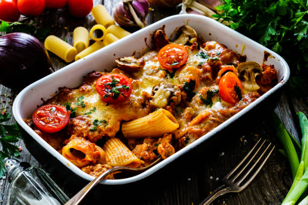 Pasta casserole with barbecue chicken breast, cheese and vegetables Pasta casserole with barbecue chicken breast, cheese and vegetables pasta casserole stock pictures, royalty-free photos & images