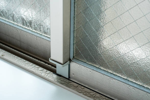 istock Dew condensation on windows in a room on a cold morning 1298529525