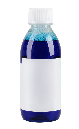 Dark blue mouthwash liquid in plastic bottle with white cap and blank label, isolated on white