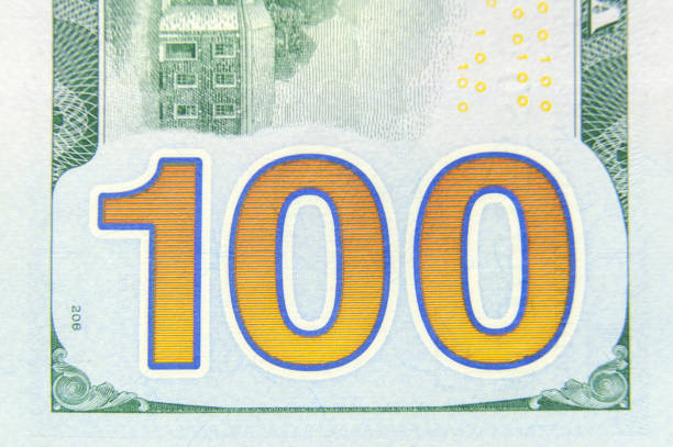 istock 100 dollars banknote closeup macro fragment. 1298531613