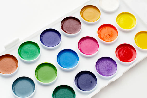 istock Watercolour paints and a palette on a white background. 1298533094