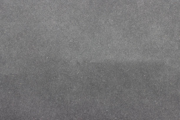 istock Texture of rough gray paper with spots 1298535422