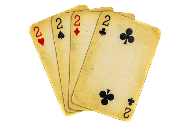 istock Four old dirty twos poker cards on a white background 1298536183