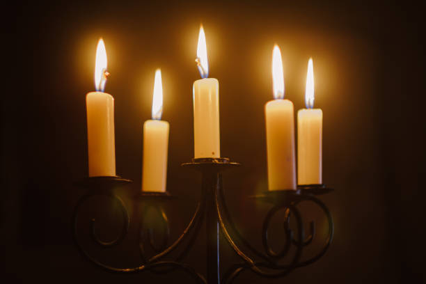 istock Burning candles on a dark background 1298540487