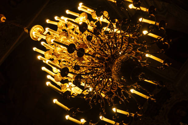 istock Chandelier with candles in the dark 1298540651