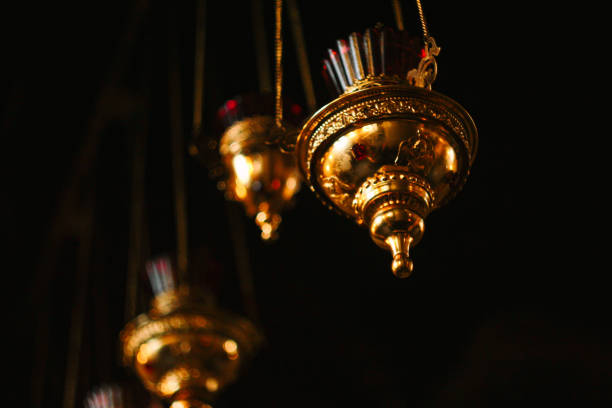 A golden censer on a dark background