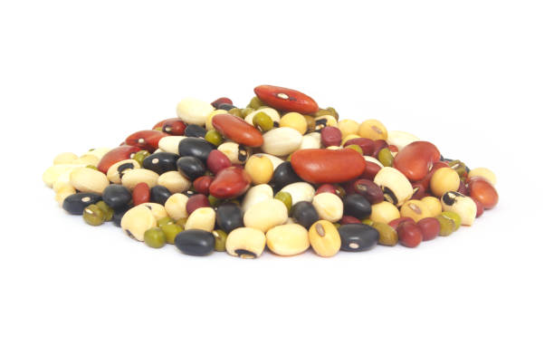 istock Heap of different beans isolated on white 1298541927