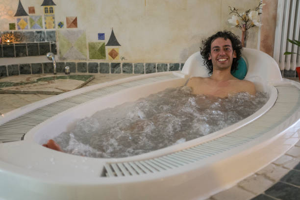 istock young man in a hot tub 1298543700