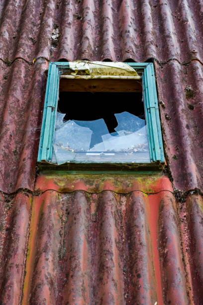 A roof window An old broken roof window breaking glass ceiling stock pictures, royalty-free photos & images