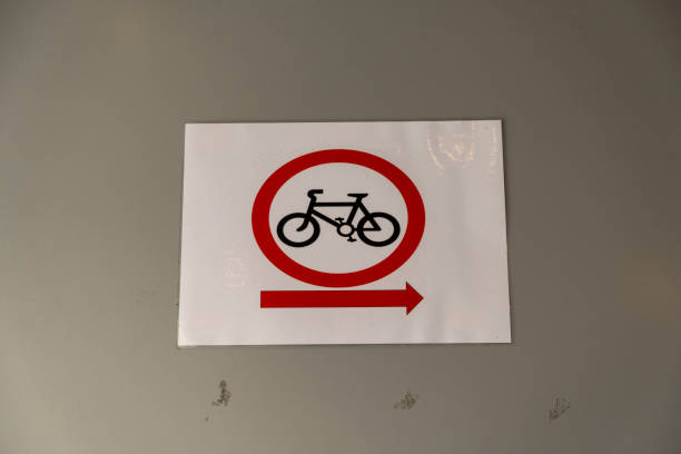 istock Sign on wall indicating where to park a bicycle 1298543754