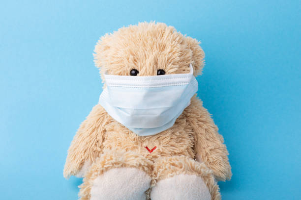 istock Teddy bear in protective facial mask 1298546405