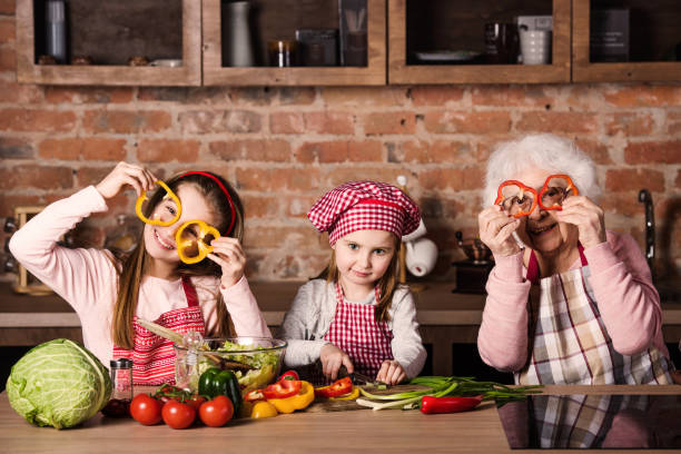 istock Granny with children at home kitchen 1298546809