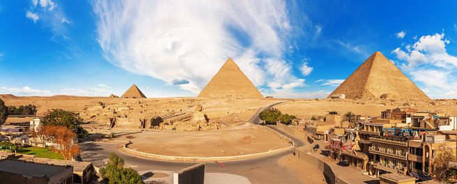 Giza panorama with the Great Sphinx near the Pyramids in Egypt.