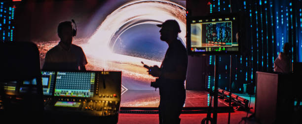Movie set in silhouettes. Large screen with projection in background