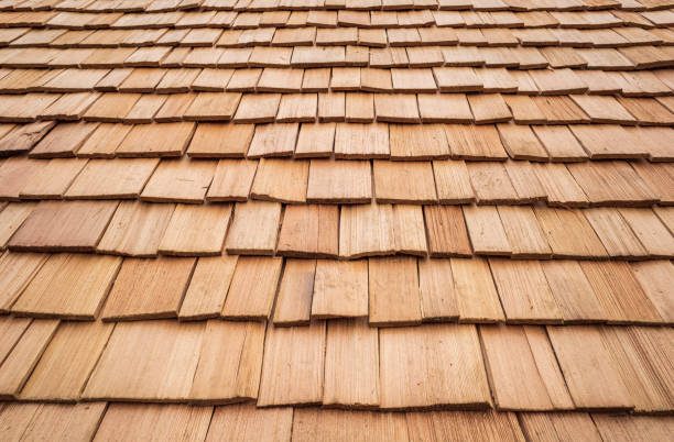 wood roof tiles on a roof stock photo