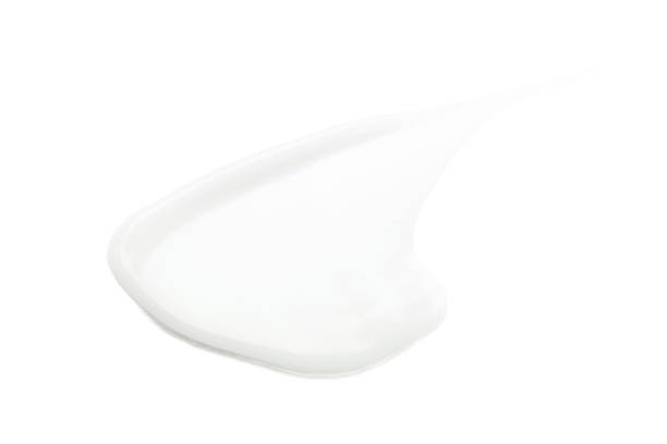 istock Smear of cosmetic cream on a white background. 1298554424
