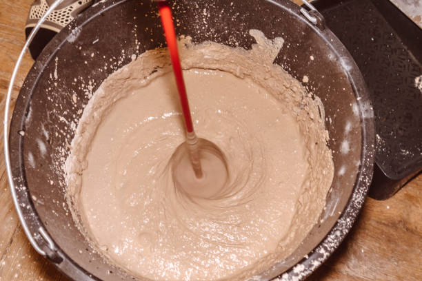 istock preparing a mortar plaster stirring mix water consistency emulsion finishing 1298555162