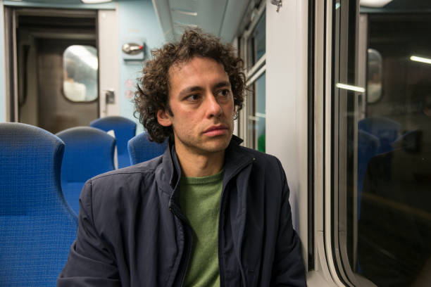 istock young man traveling on a train 1298556629