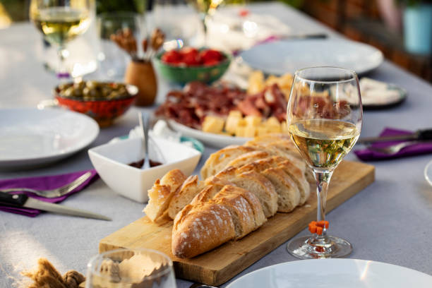 istock Set up table with white wine and appetizers 1298557194
