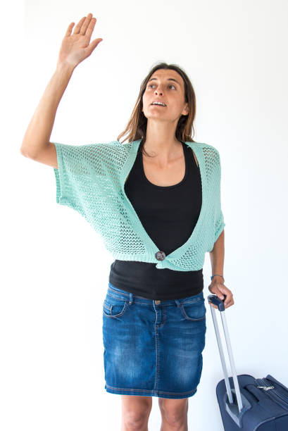 istock woman hailing a taxi 1298558986