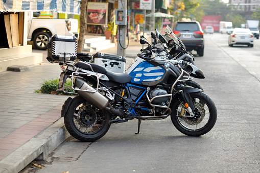 Parked BMW GS1200 in Bangkok captured in Ladprao district. Tank is blue and white colored