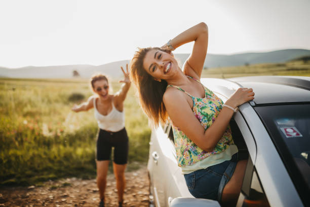 istock Girlfriends on summer road trip 1298559771