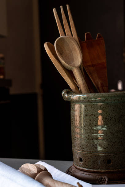 istock Zero waste kitchen wooden kitchen utensils in ceramic pot in kitchen,ecology ,no plastic. 1298563798