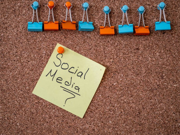istock Adhesive note with social media text pinned on a bulletin board 1298564289