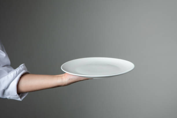 chef uniform with white empty plate welcome present dish restaurant promotion