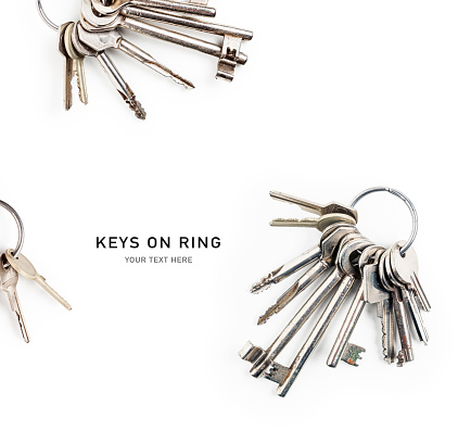 Keys on key ring creative layout isolated on white background. Design element, top view, flat lay. Security concept