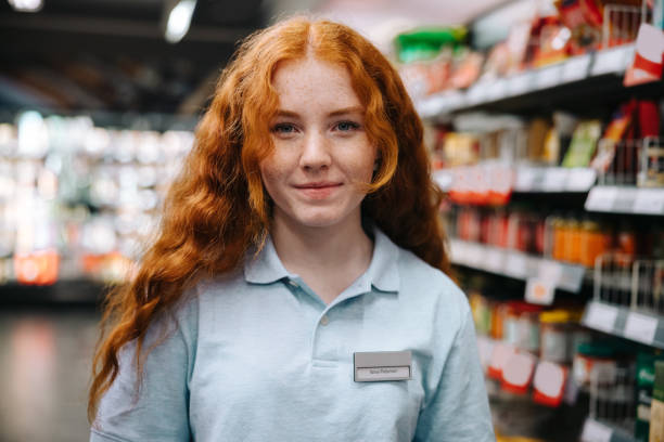 istock Young worker working in the grocery store 1298570686