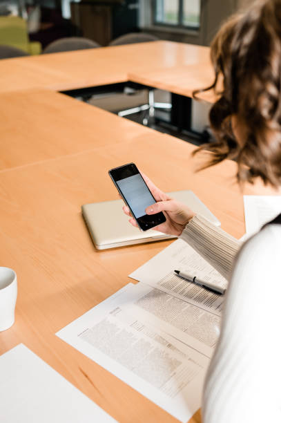 istock Woman use smartphone in the office. 1298572555