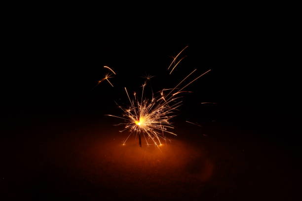 istock sparklers, bengal fire burns in a snowdrift at night 1298573327