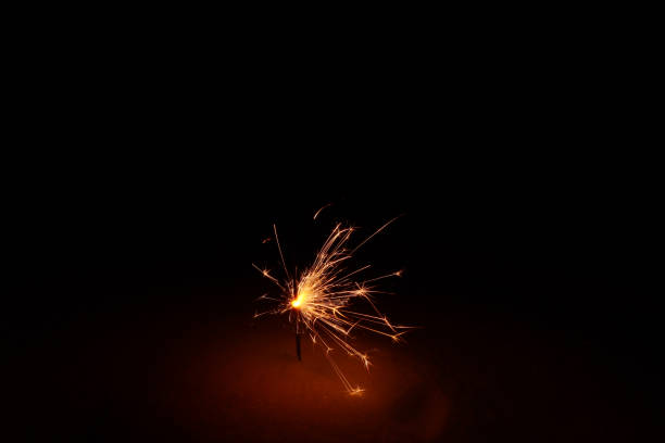 istock sparklers, bengal fire burns in a snowdrift at night 1298574081