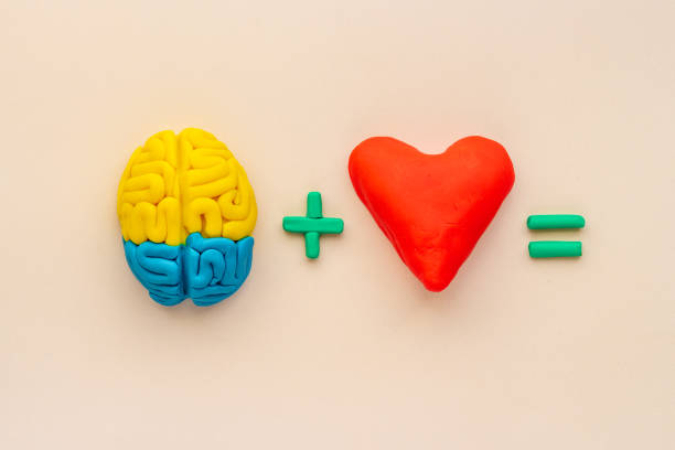 istock Think with love - heart and brain concept, top view 1298574921