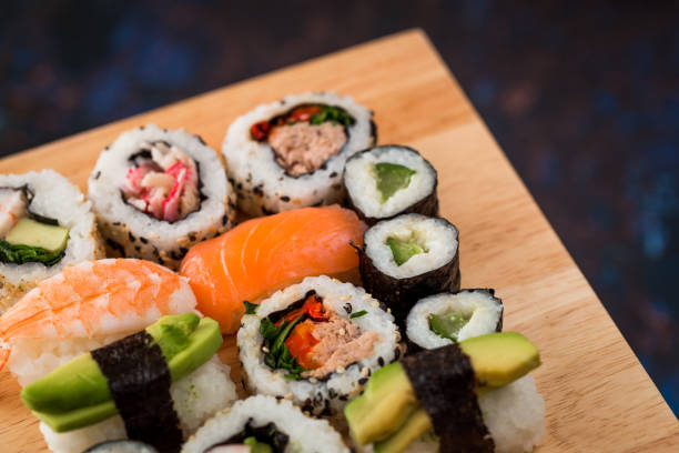 istock Fresh sushi selection on wooden board 1298575515