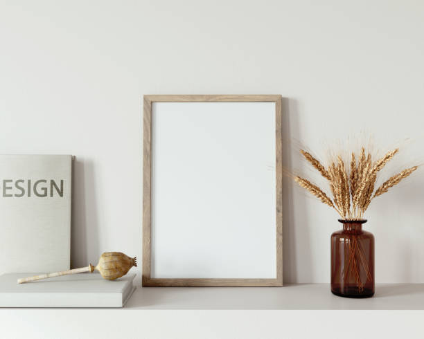 istock Interior Frame Mockup with wooden frame, vase and books 1298576392
