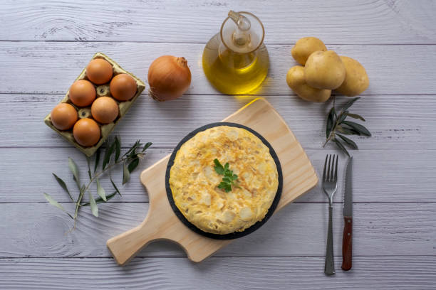 istock Traditional spanish omelette on wooden table 1298576600