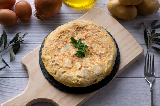 istock Traditional spanish omelette on wooden table 1298576627