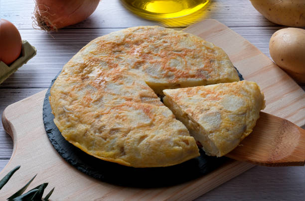 istock Traditional spanish omelette on wooden table 1298576645